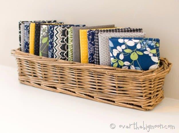 DIY linen dinner napkins, a cheap home sewing project with a stack of folded gray and patterned napkins in a basket