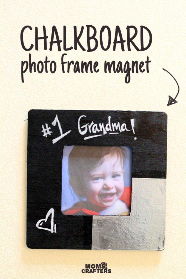 A wooden picture frame whose glass is painted as a chalkboard hangs in a hallway, a short message lettered on it