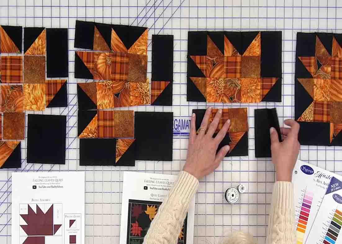 Sewing the rows of the falling leaves quilt together