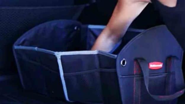 Ingenious car organizing, a navy collapsible trunk organizer with mesh dividers packed beside a tote in a trunk