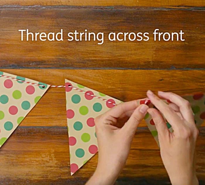 Learn to make a DIY flag garland from old wrapping paper