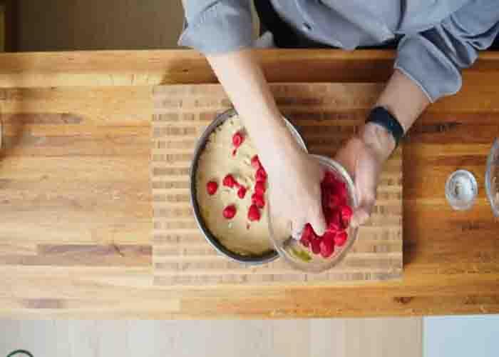 Placing the raspberries on top of the cake
