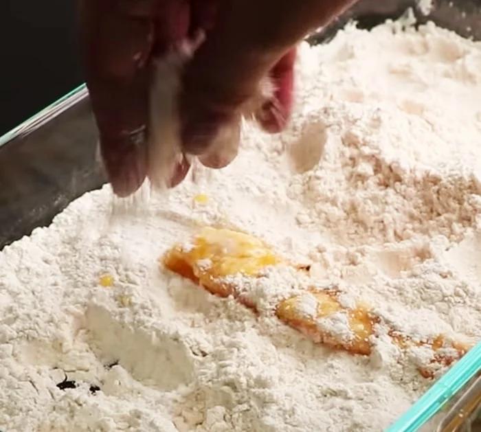 KFC Crispy Chicken Strips - coating the marinated strips in seasoned flour