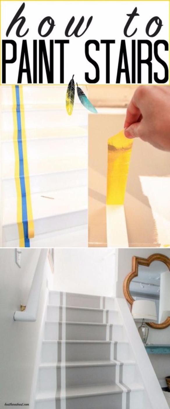 White painted staircase with a gray painted runner stripe down the centre, shown with tape and a paintbrush in progress