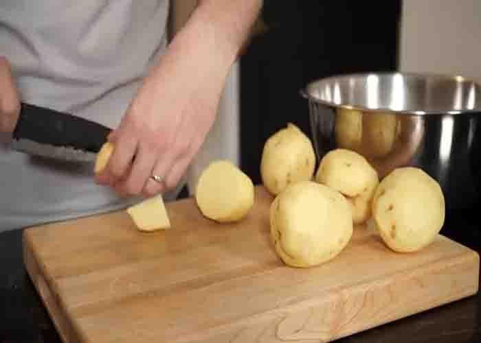 Cutting the potatoes into small chunks