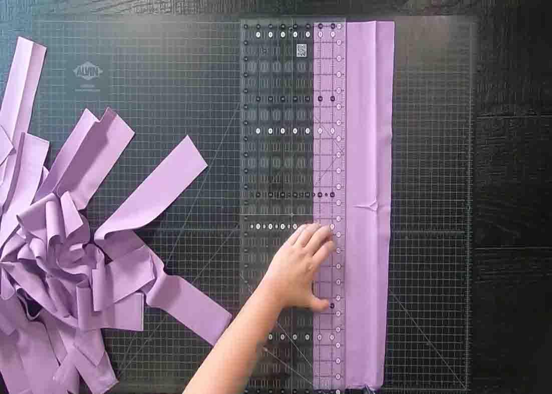 Cutting the fabric into strips for the rainbow road quilt