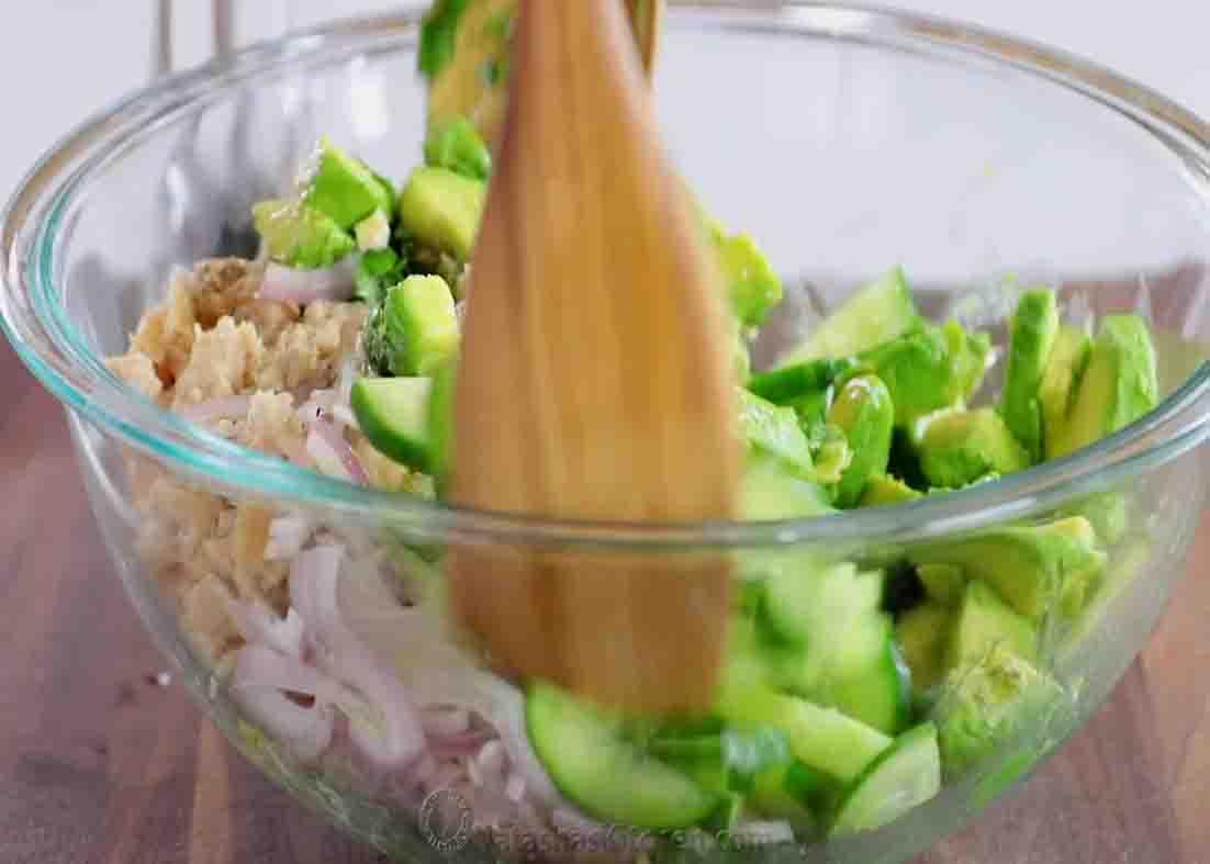 Tossing all the ingredients to combine