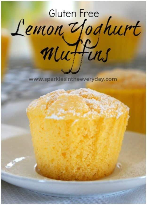 Gluten free lemon yoghurt muffins dusted with icing sugar and served with fresh berries and thick cream
