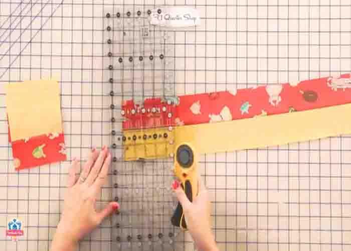 Cutting the strip set to make the jelly roll twist quilt