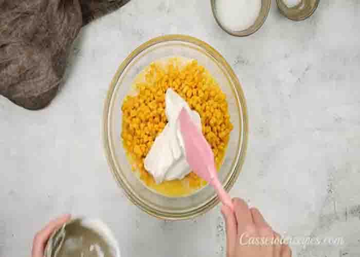 Combining the corn casserole ingredients