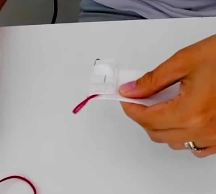 Use a paper towel , a stapler, and 2 rubber bands to make a face mask