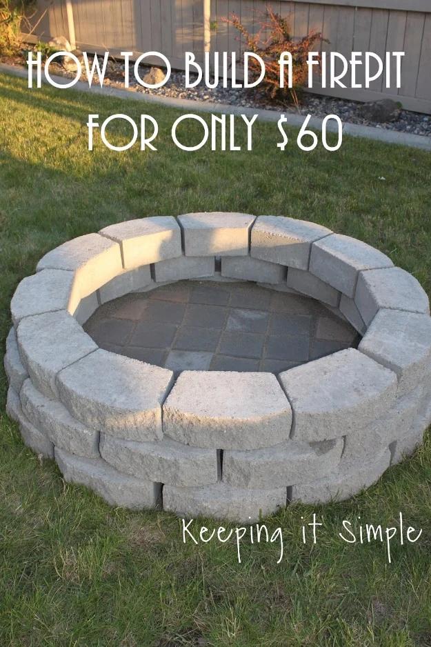 Budget DIY firepit graphic reading How To Build A Firepit For Only $60 over a finished gray paver ring on grass