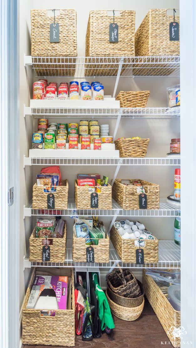 Small wire shelving pantry with seagrass baskets, chalkboard tags, canned goods and clear labeled canisters