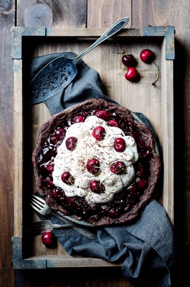 Black Forest pie with a dark chocolate crust, cherry filling, whipped cream topping and shaved chocolate curls