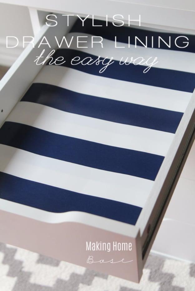 Stylish drawer lining graphic with a white drawer lined in wide navy and white striped wrapping paper