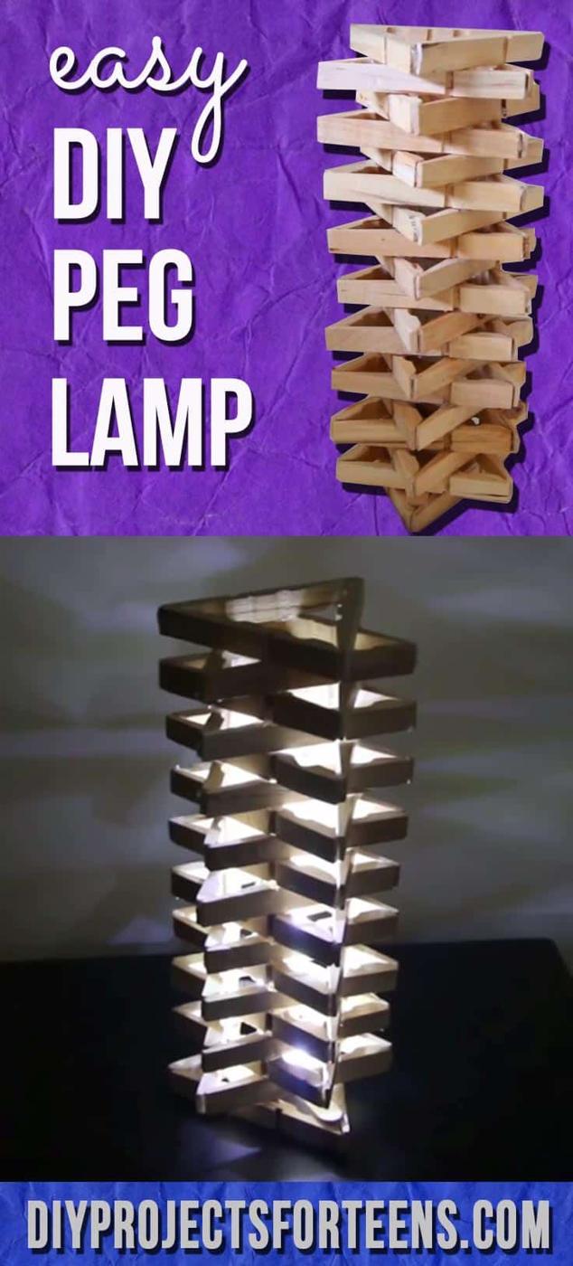 DIY clothespin lamp, a tall column of stacked wooden clothespins glowing from within on a dark surface