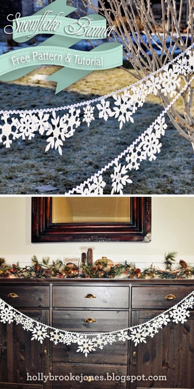 White felt snowflake banner strung on ric rac, shown outdoors on bare branches and across a dark dresser