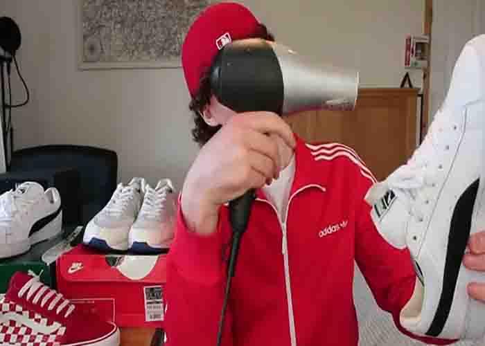Heating up the shoes using hair dryer to make it bigger