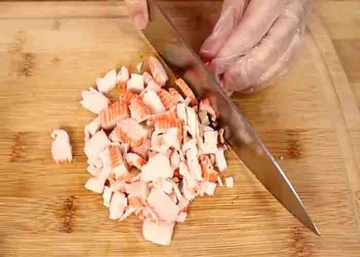 Chopping the shrimp and crab for the appetizer recipe