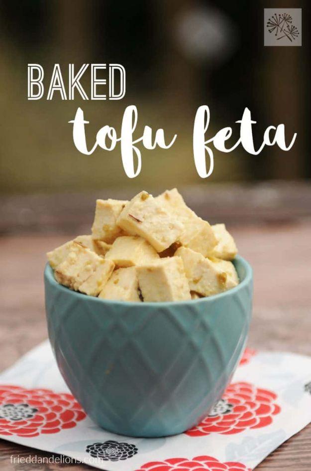 Graphic titled Baked Tofu Feta showing pale cubed tofu feta in a teal bowl set on a floral cloth napkin