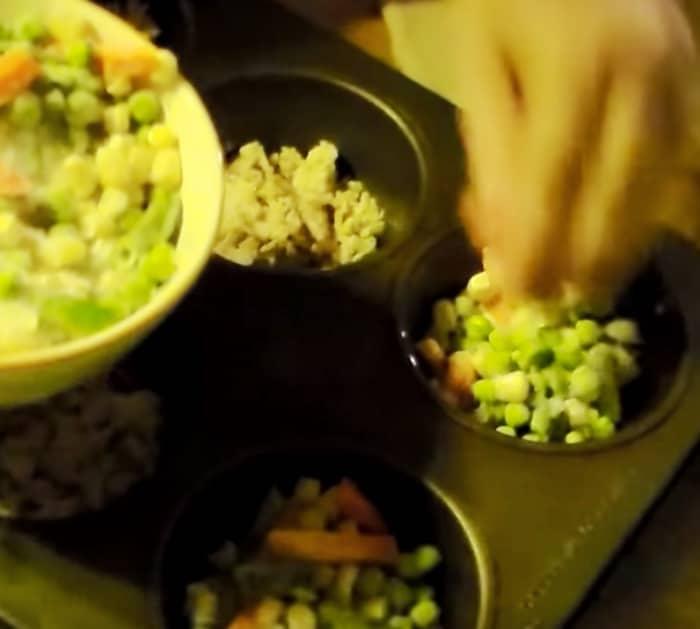 Make mini chicken pot pies with pop biscuits and frozen vegetables and rotisserie chicken