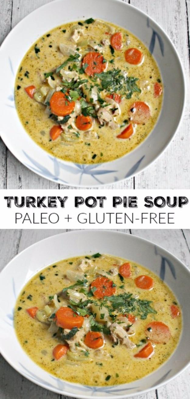 Turkey pot pie soup with shredded leftover turkey, carrots and potatoes in a creamy broth in a white bowl