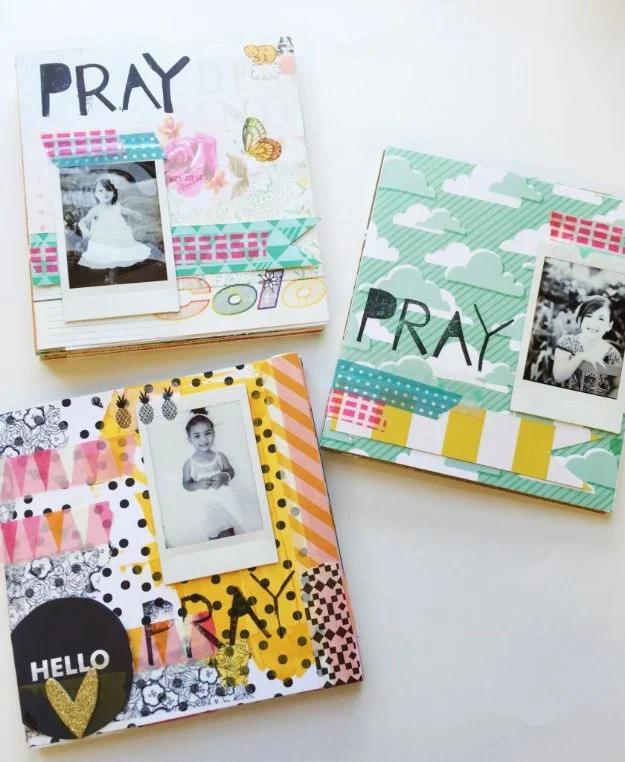 Three handmade prayer journals covered in washi tape, patterned paper and instant photos with PRAY lettered on the covers