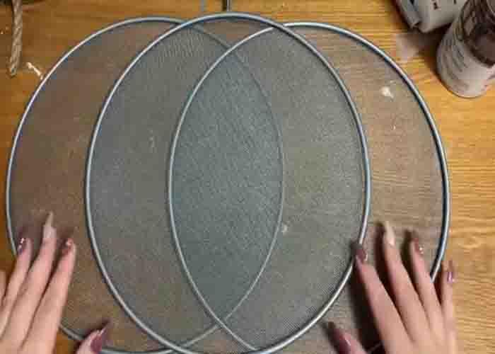 Attaching the splatter screen together to make the pumpkin