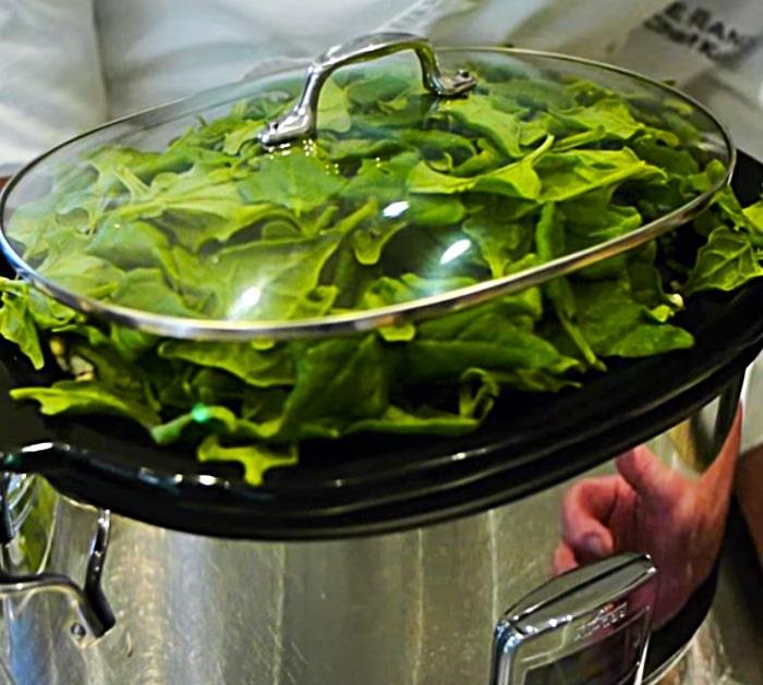 Place Fresh Spinach On Top Of Hoppin' John Before Cooking