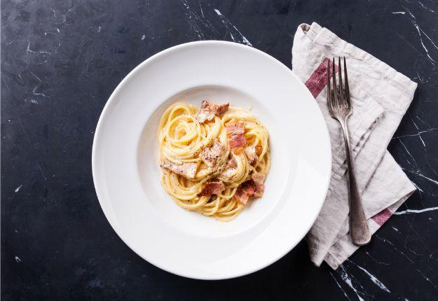 A plate of Tom Cruise spaghetti carbonara with crisp pancetta, a simple celebrity inspired pasta dinner
