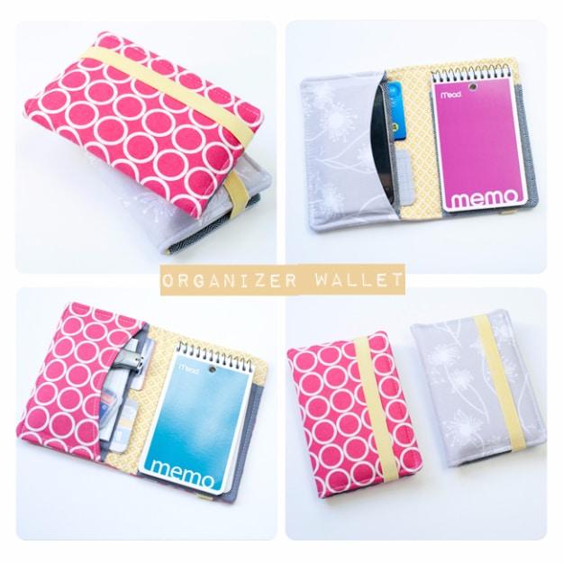 A wallet organizer in printed cotton opened flat to show card slots and a note pocket, snap closed, on a craft fair table