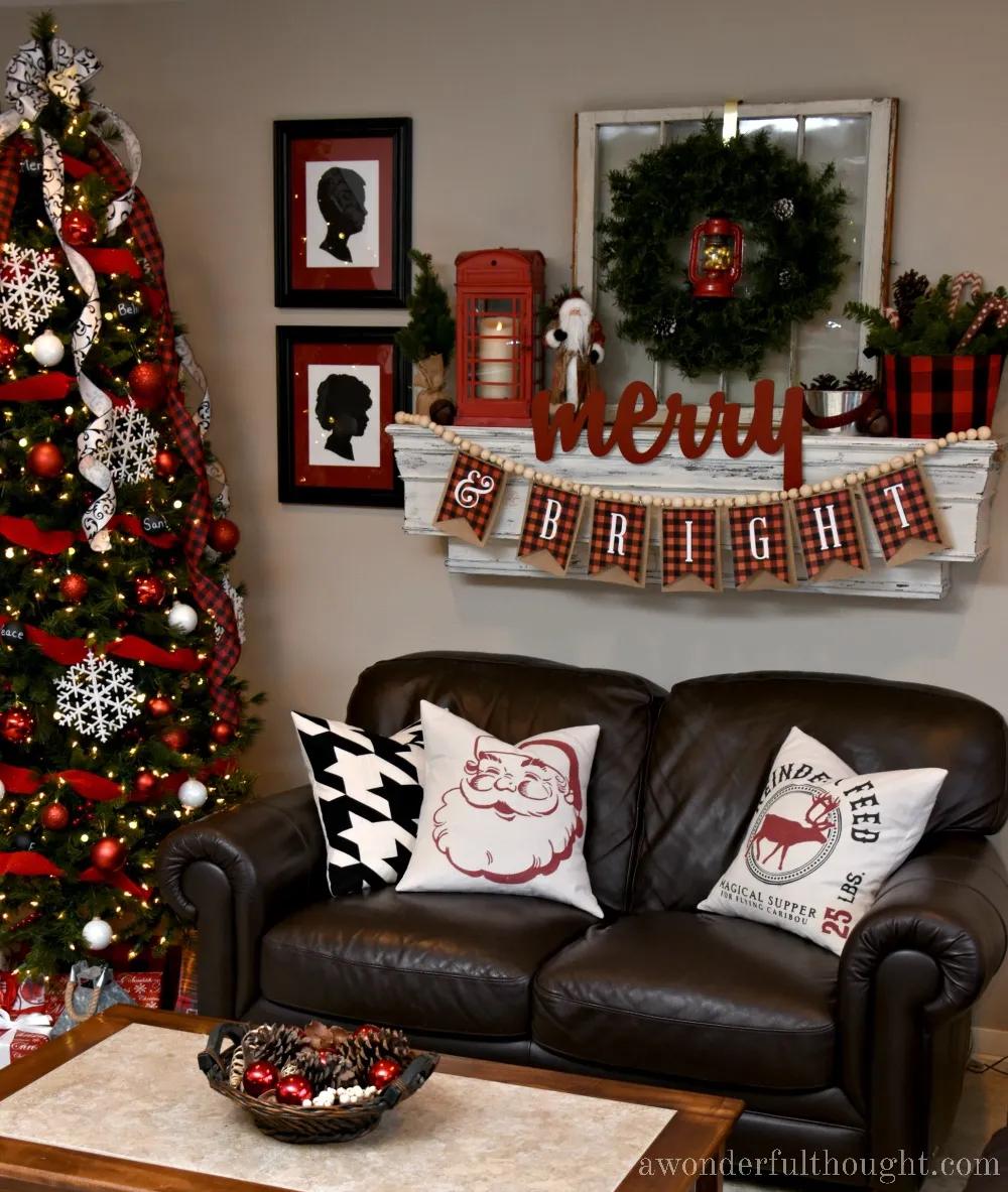Drop cloth pillow covers spray painted with a Santa silhouette and Reindeer Feed lettering on a living room sofa