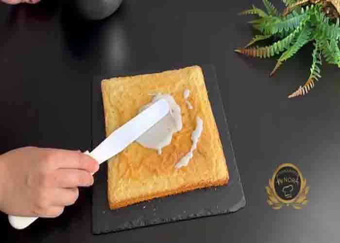 Spreading the glaze on the lemon brownie
