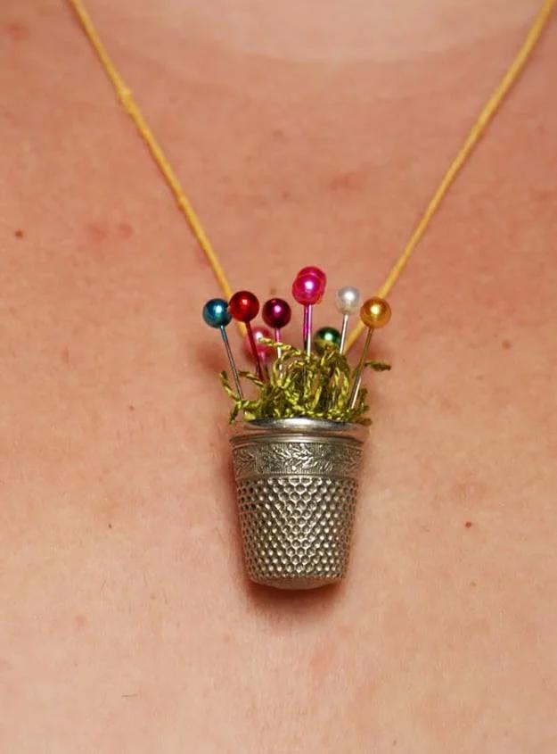 Vintage sewing thimble strung on a chain into a necklace, an unexpected jewelry craft with story appeal for buyers