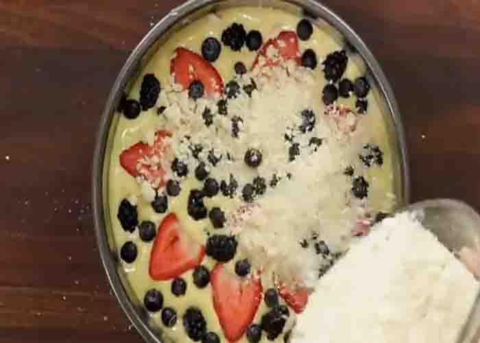 Assembling the berry crumb cake