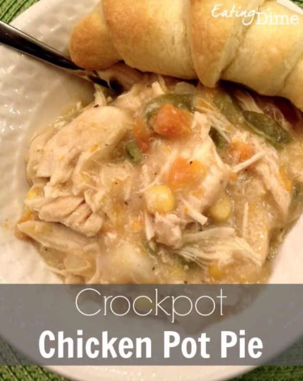 Crock pot chicken pot pie with vegetables and potatoes topped with a baked biscuit, easy slow cooker meal
