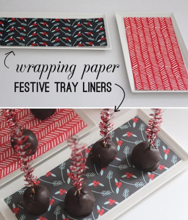 Festive tray liner graphic showing white trays lined in charcoal sprig and red herringbone wrapping paper