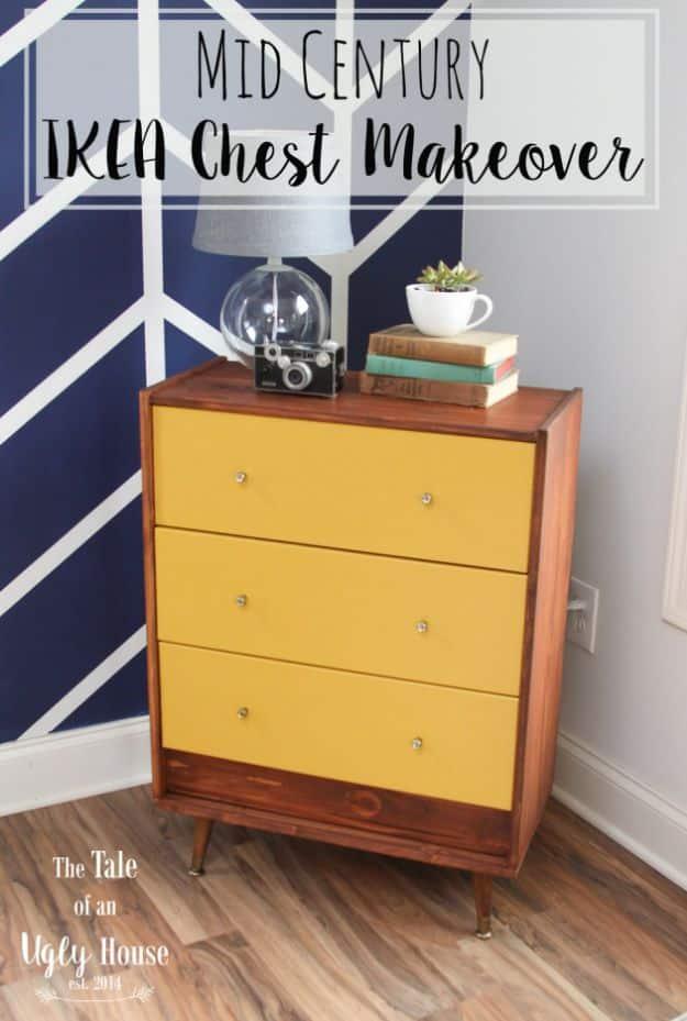 Yellow and walnut IKEA Rast chest with glass knobs and brass capped tapered legs against a navy geometric painted wall