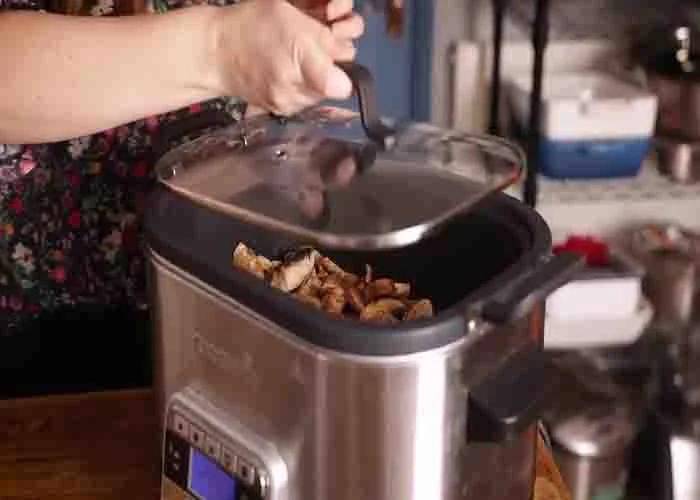 Slow cooking the smothered pork chops