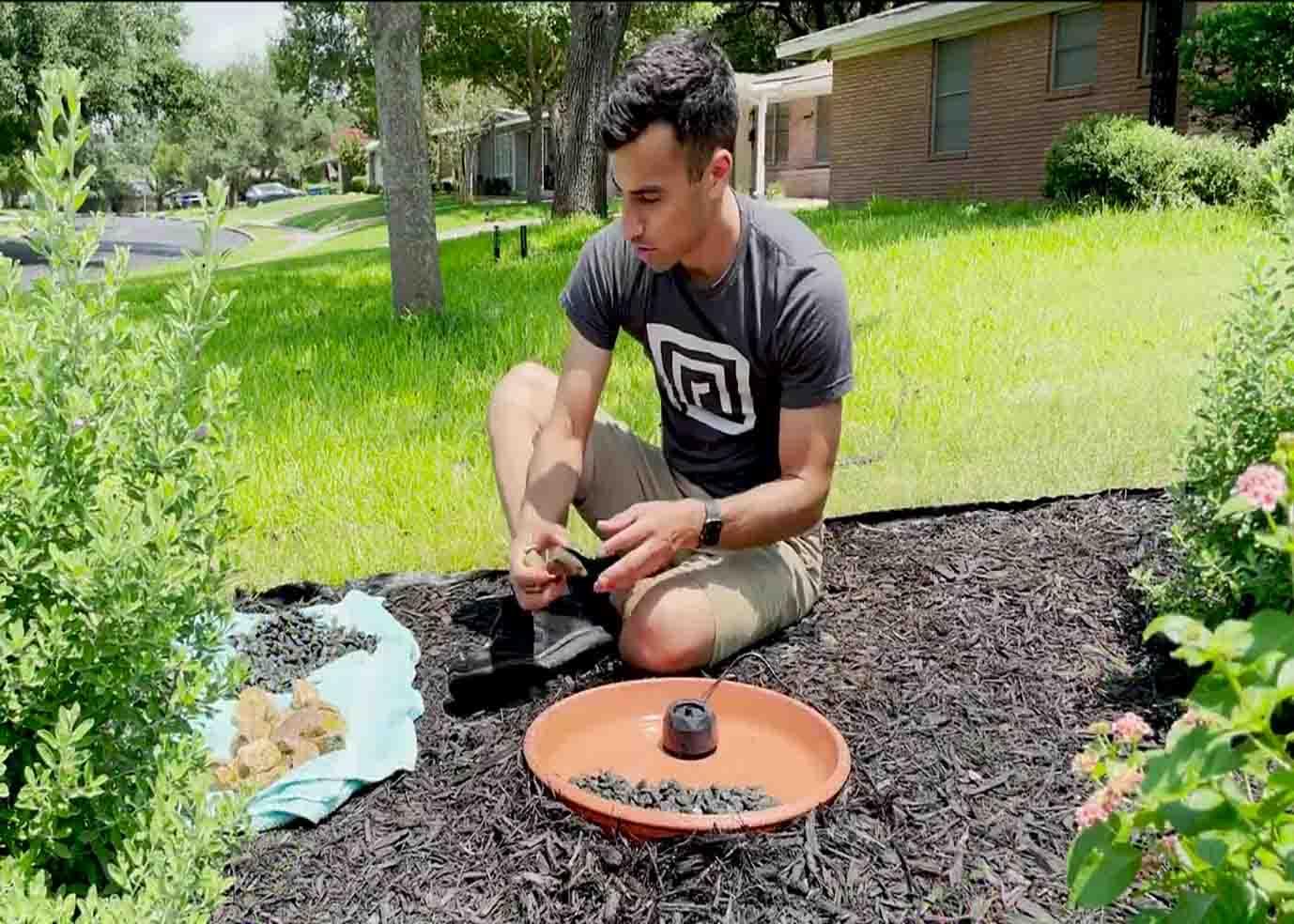 Placing the small rocks to the mini fountain