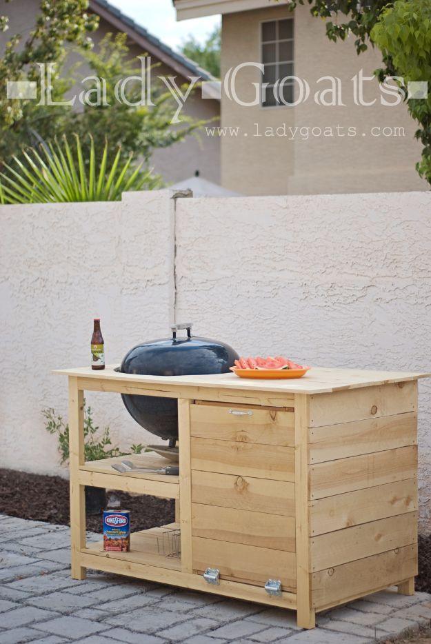 DIY potting table in pale cedar with an open lower shelf and a kettle grill sunk into a recess cut in the work top