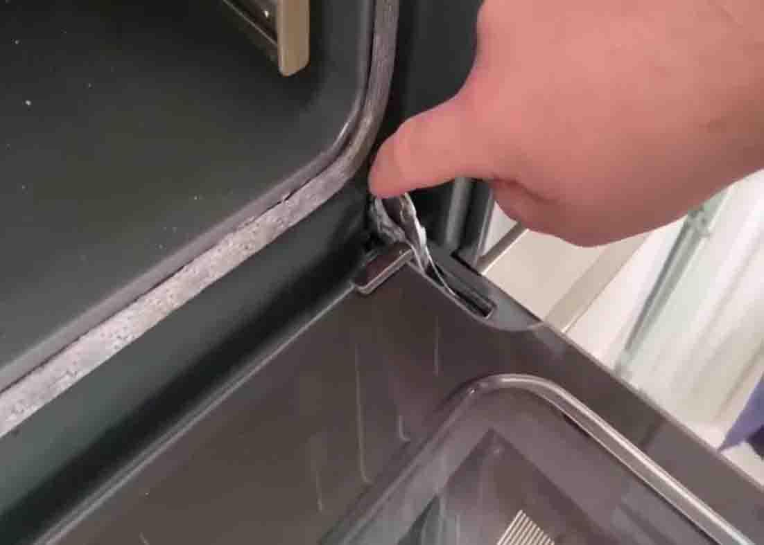 Removing the glass door from the oven