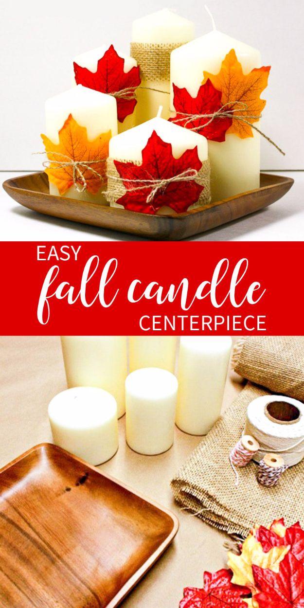 Fall candle centerpiece graphic showing white pillar candles wrapped with red and orange leaves on a wood tray