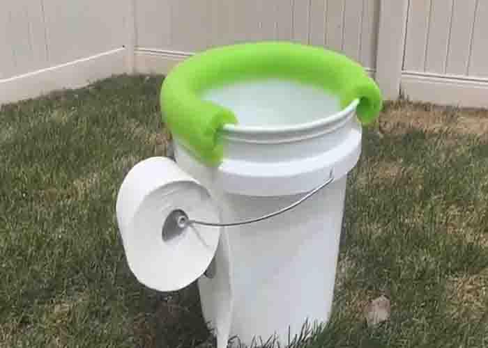 Using a pool noodle to cover the seat part of a makeshift camping toilet