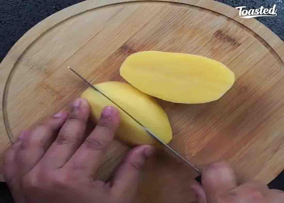 Chop the potatoes into wedges
