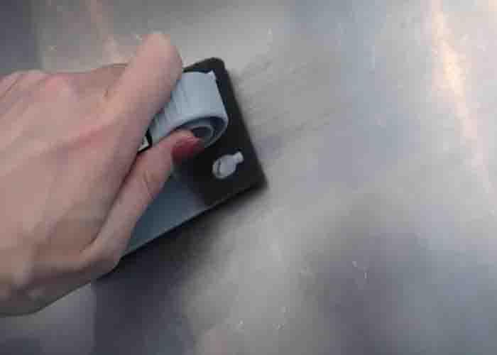 Removing the scratches from the stainless steel