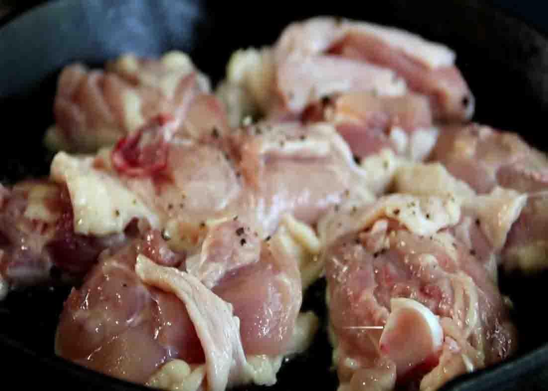 Frying the chicken before adding them to the tomato rice mixture
