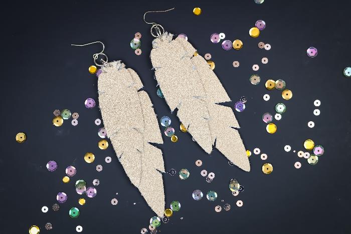 Glitter faux leather feather earrings, two long silver glitter feathers on silver wires scattered with loose sequins