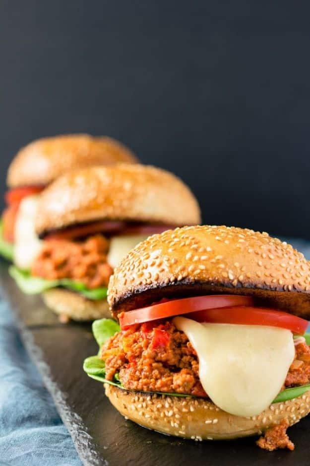 Paleo sloppy joes made with thick tomato paste and seasoned ground beef piled onto a toasted hamburger bun
