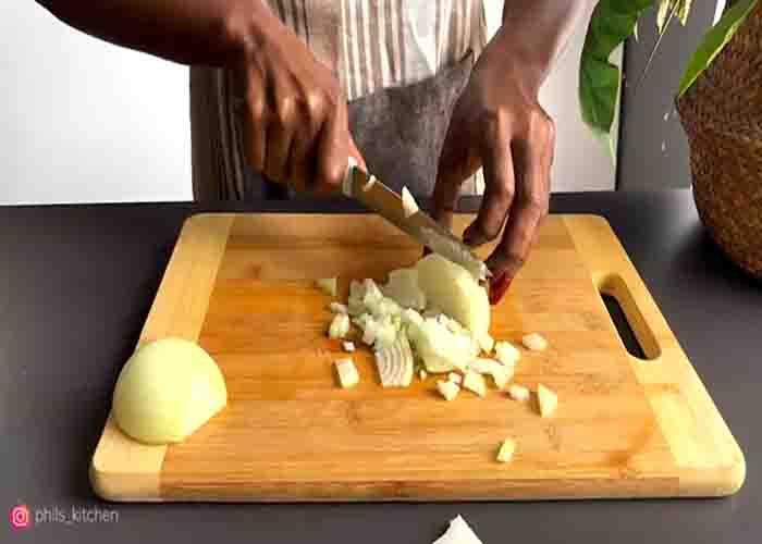 Chopping the onions for the sausage stew